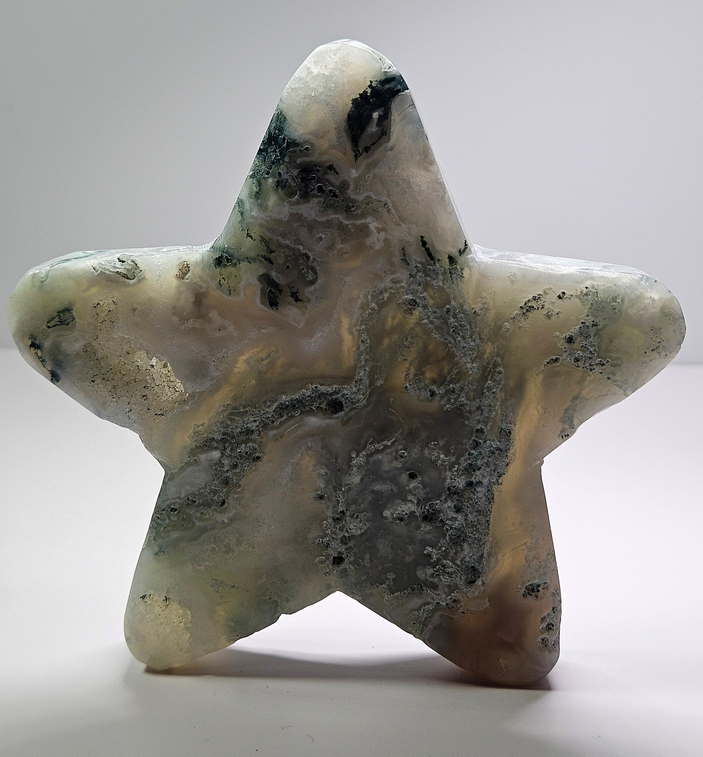 Moss agate star carving