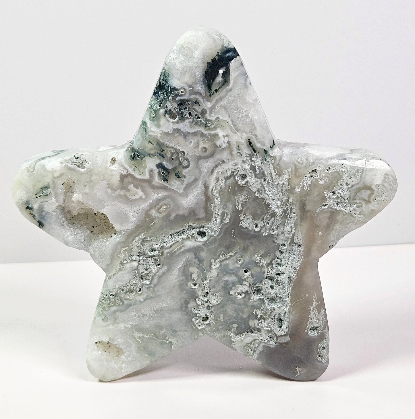 Moss agate star carving