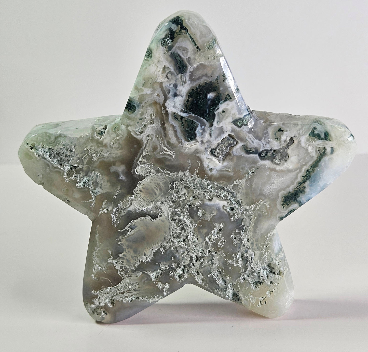 Moss agate star carving